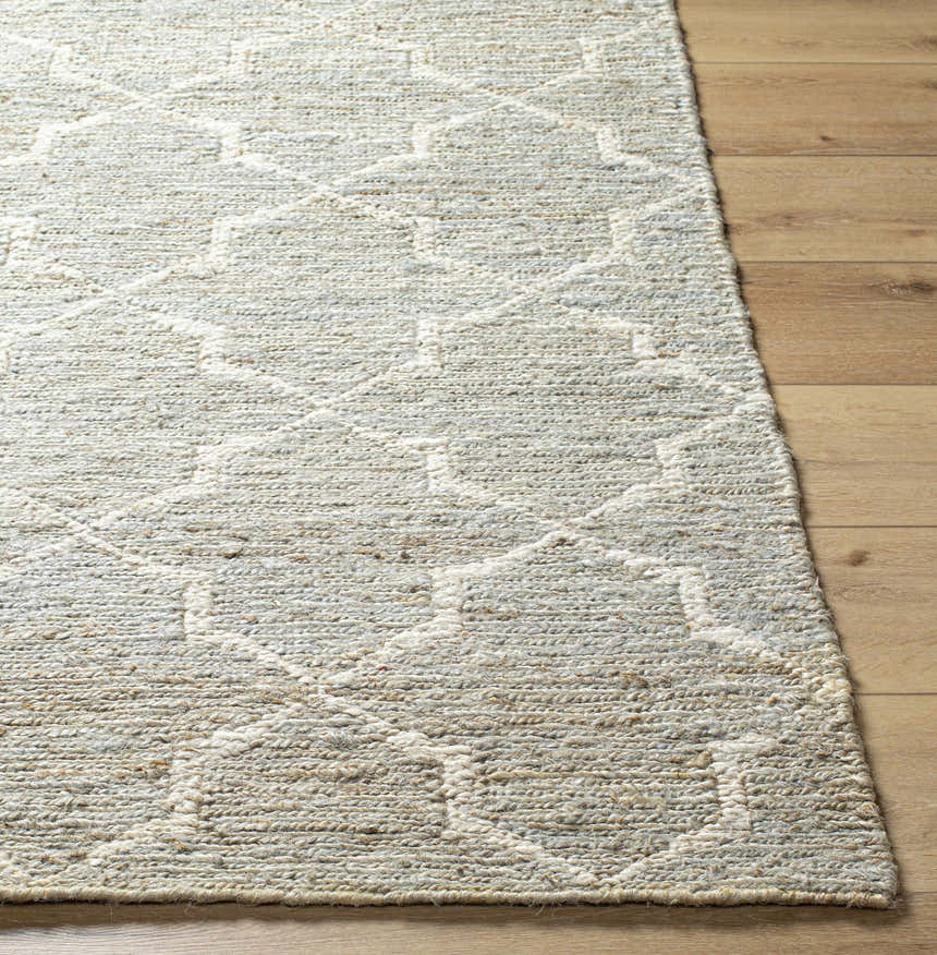 Close-up of the beige and gray Damawato Jute Carpet showing the hand woven texture and geometric pattern. Front