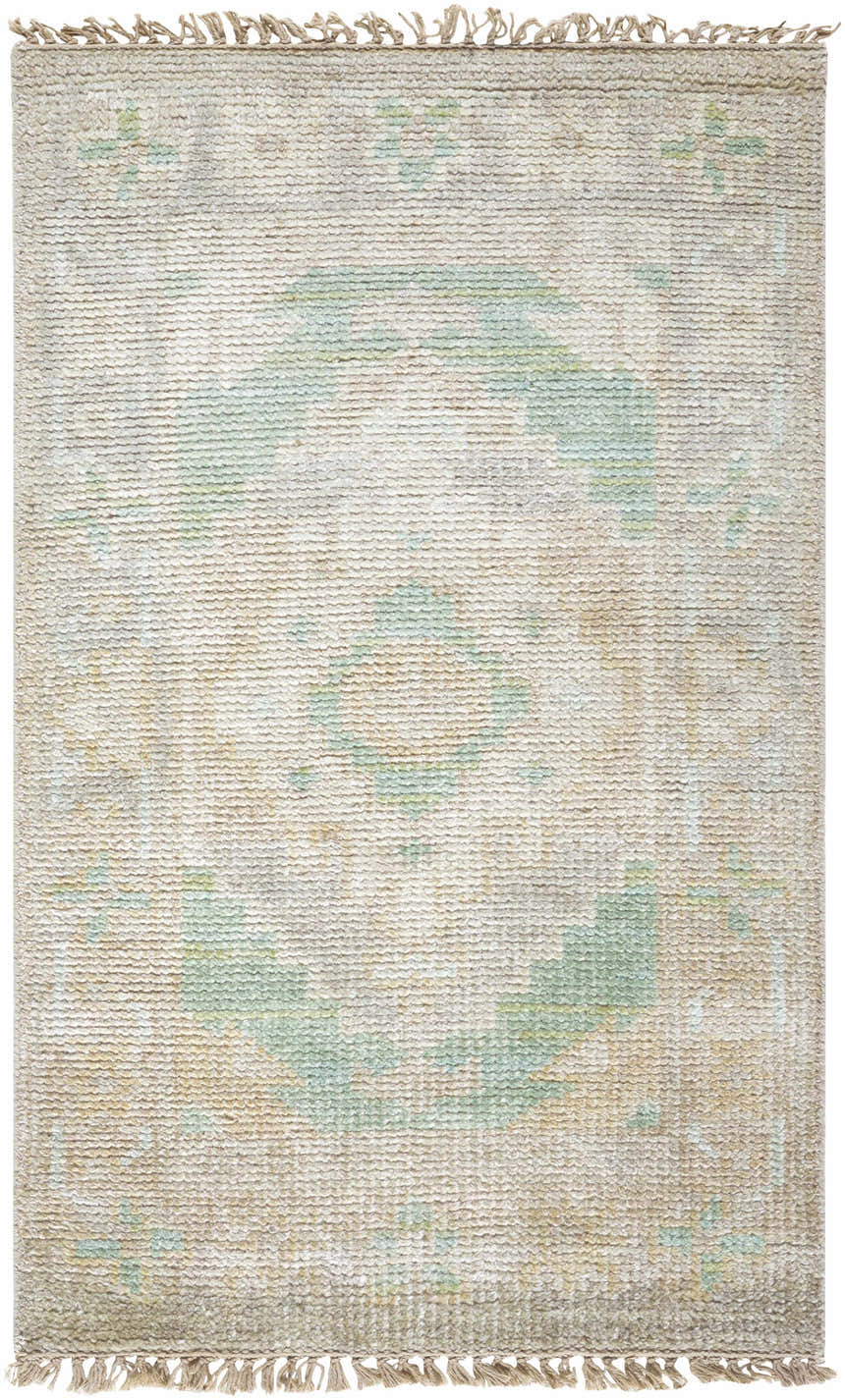 Close-up of the hand-knotted Danao Premium Rug. Cream wool rug with light sage, ice blue, and dusty pink accents. Design-Rectangle-23