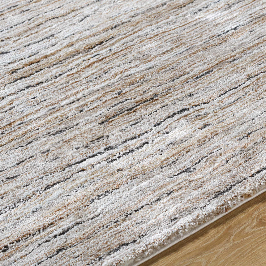 Close-up of the Wantu Luxe Thick Area Rug. Features ivory, tan, and black stripes with a soft, textured pile. Texture
