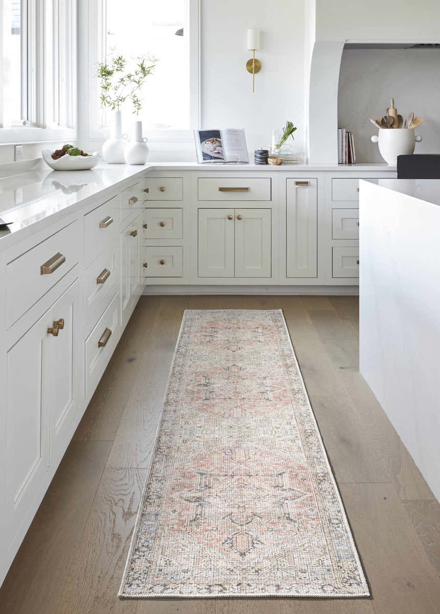 Farmhouse kitchen with white cabinets and Aethwy Washable Area Rug runner in light silver, prairie dust, silver gray, and slate blue. Roomscene-Runner