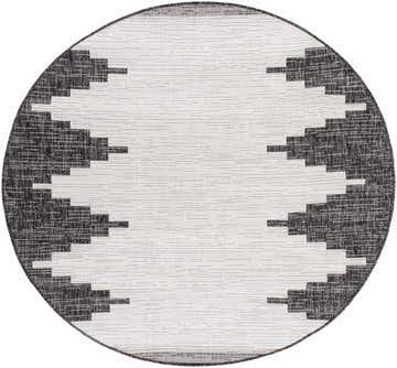 Close-up of a round Djugun Outdoor Rug with a black and off-white Southwestern-inspired geometric pattern. Design-Round-53