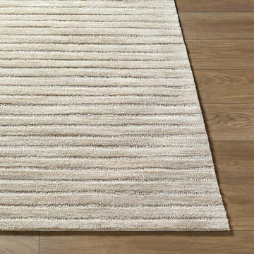 Close-up of the hand-tufted Destry Beige Area Rug showing its textured, horizontal striped design and wool material. Front