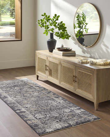 Entryway with a farmhouse style wood console table and Abiram runner rug in black, gray, and ivory. Roomscene-Runner