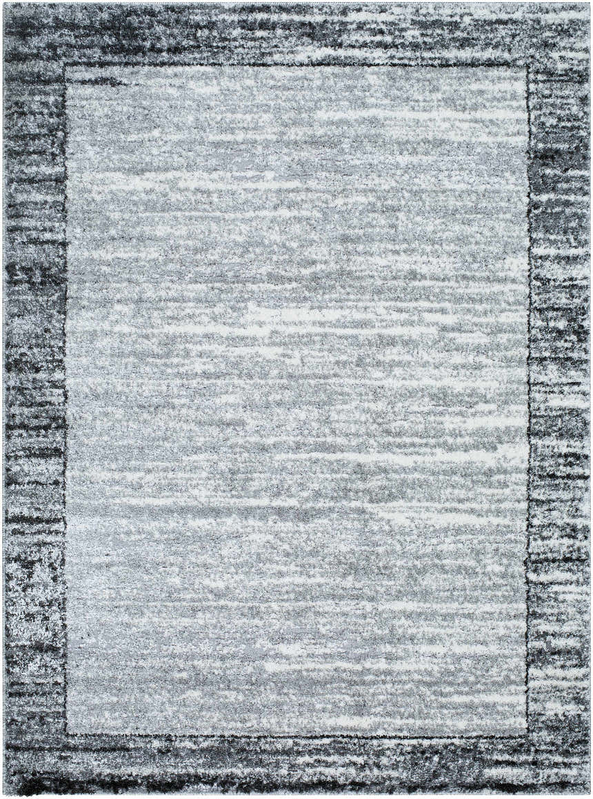 Close-up of the Dhaval Black Area Rug, showcasing its charcoal, light gray, and black hues and subtle textured pattern. Design-Rectangle-5373