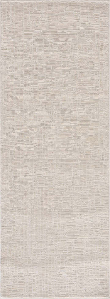 Close-up of the Leanna Cream Washable Area Rug. Solid cream rug with subtle geometric pattern and soft texture. Design-Runner