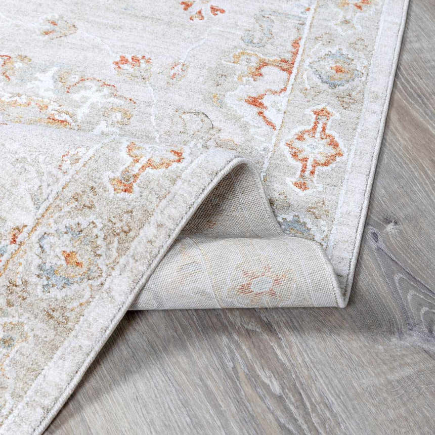 Close-up of the Elimbah Thick Luxe Area Rug showing beige, brick red, and charcoal colors with a traditional oriental pattern. Fold
