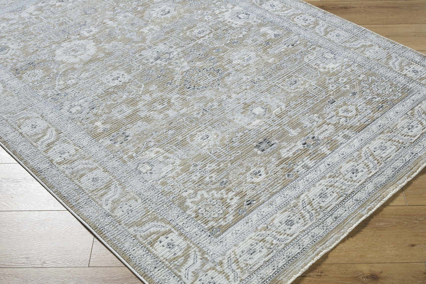 Close-up of the Alexia Light Gray Area Rug showing its traditional floral pattern and soft charcoal, gray, and beige colors. Corner