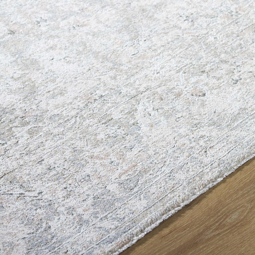 Close-up of the Azania Area Rug showing its cream, light sage, and slate blue tones and soft, textured weave. Texture