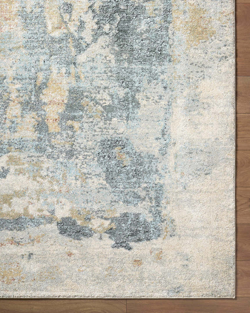 Close-up of the Alanna Thick Luxe Area Rug showing its beige, gray, and teal contemporary design and plush texture. Corner
