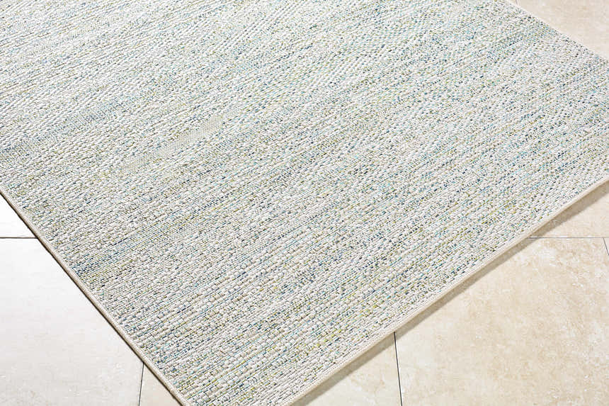 Close-up of the Alezae Ivory Area Rug showing its woven texture and subtle ivory, gray, and pale blue colors. Corner