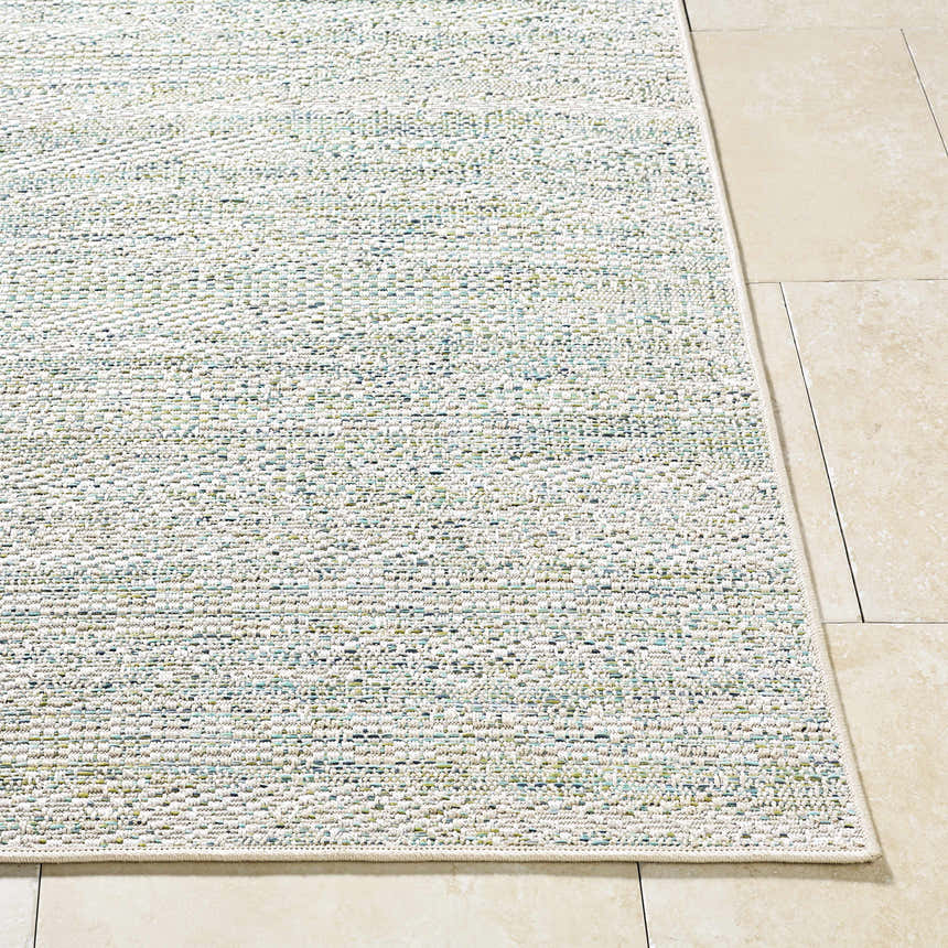 Close-up of the Alezae Ivory Area Rug showing its woven texture and subtle ivory, gray, and blue colors. Front