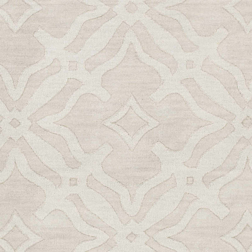 Close-up of Fyffe Embossed Beige Wool Area Rug. Neutral rug with raised geometric pattern, soft texture. Swatch