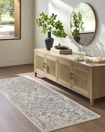 Entryway with Alissa Cream runner rug, wood console table, round mirror, and hardwood floors. Farmhouse style. Roomscene-Runner