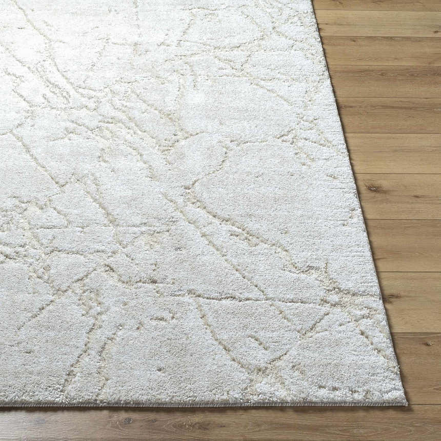 Close up of the Genkei Light Gray Area Rug showing its subtle geometric pattern and soft texture. Front