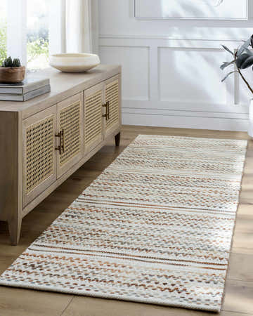 Entryway with a Griet Hand Woven Wool Rug runner in beige, bone, and brown tones, complementing the wood floors and console table. Roomscene-Runner