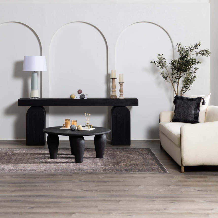 Living room scene with a beige sofa and black furniture, featuring the Greenpoint Dusty Blue Washable Rug. Roomscene-Rectangle