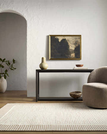 Living room scene with a neutral Hiroto Sandstone area rug, console table, art, and modern chair. Roomscene-Rectangle