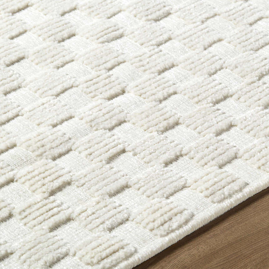 Close-up of the Anthea Off-White 3D Checkered Washable Rug showing its textured, geometric pattern. Texture