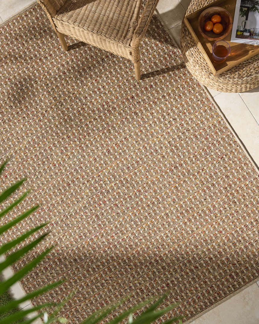 Close-up of the Ataret Burnt Sienna Area Rug, a machine-woven rug with terracotta, goldenrod, and ivory tones. Roomscene-Rectangle