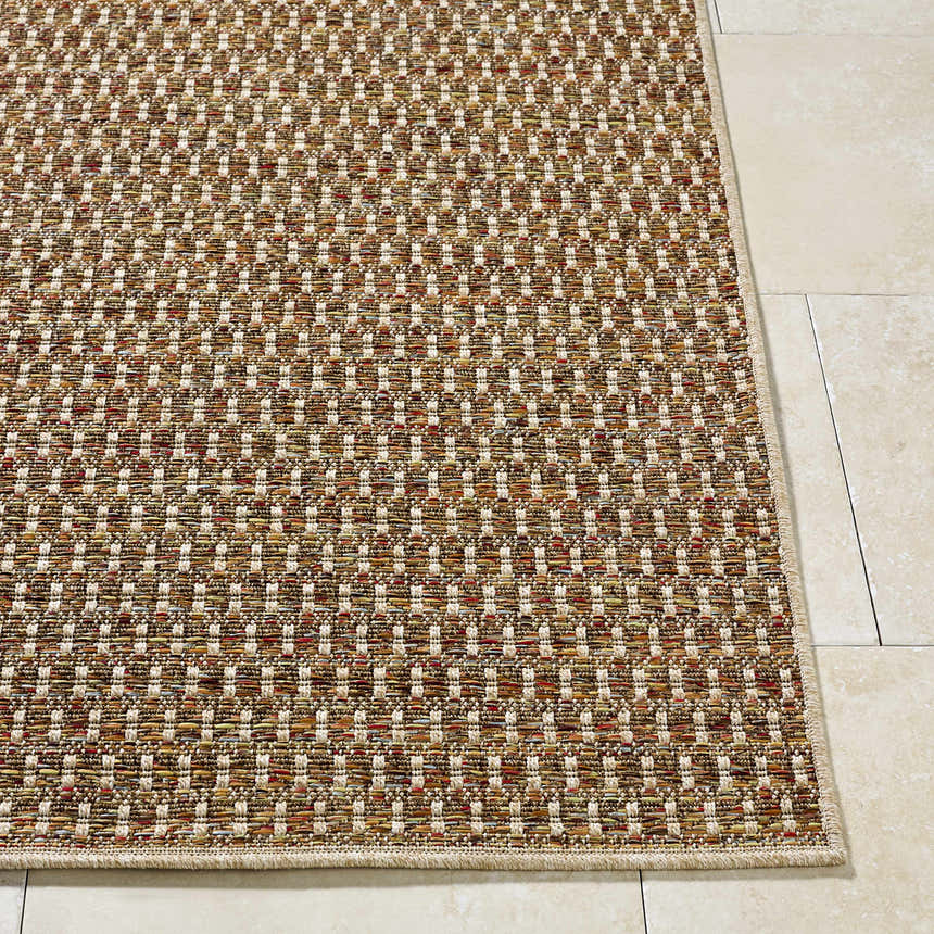 Close-up of the Ataret Burnt Sienna Area Rug. Woven texture with burnt sienna, goldenrod, ivory, and terracotta tones. Front