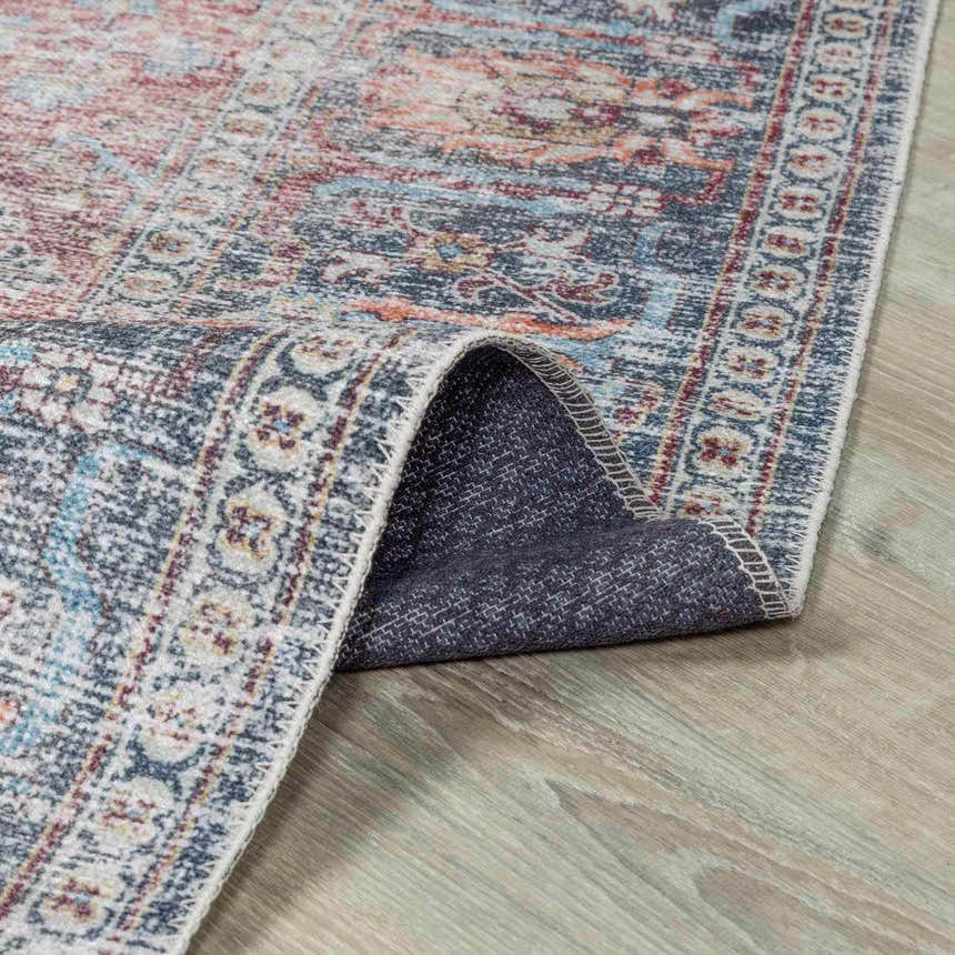 Close-up of Blue Burgundy Holi-2302 washable rug showing its traditional Persian design, colors, and non-slip backing. Fold