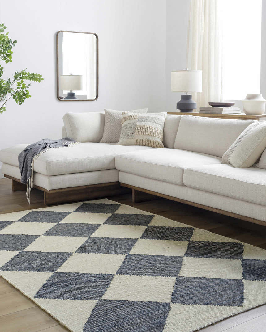 Living room scene with beige sectional sofa and Andrin Gray Area Rug with checkered pattern. Roomscene-Rectangle
