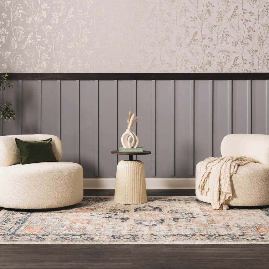 Living room scene with cream chairs and the brick red and navy Dorval Traditional Rug. Roomscene-Rectangle