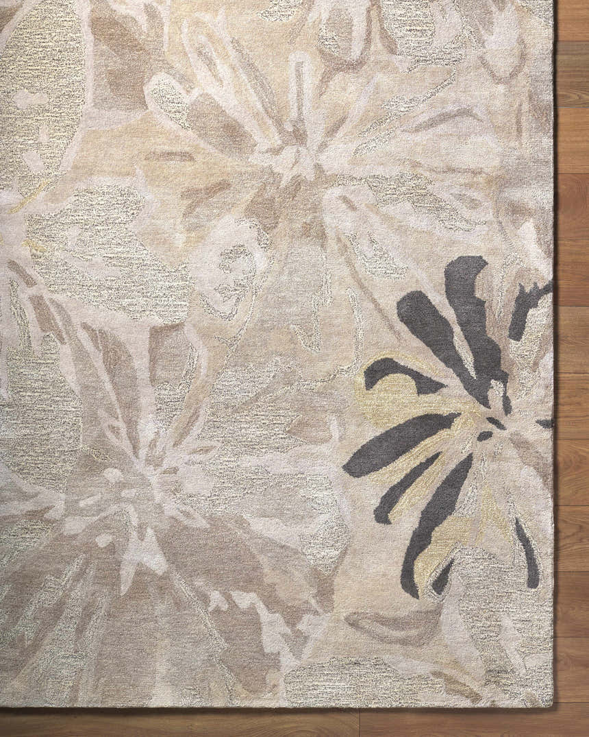 Close-up of the Ilfeld Athena Gray Floral Wool Rug, featuring charcoal, brown, and gray floral pattern and hand-tufted texture. Corner