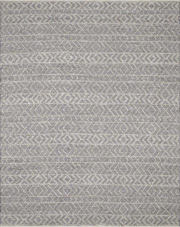 Close-up of the Ironia Handmade Faux Silk Rug, featuring a geometric diamond pattern in dark blue, gray, and light gray. Design-Rectangle