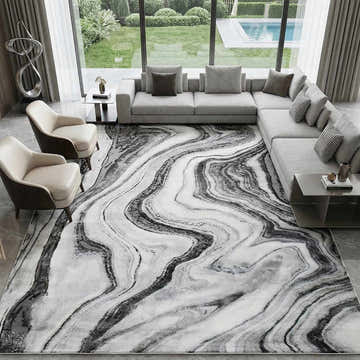 Living room with gray sectional and Itotia Marble Green Area Rug featuring a swirling marble design. Roomscene-Rectangle