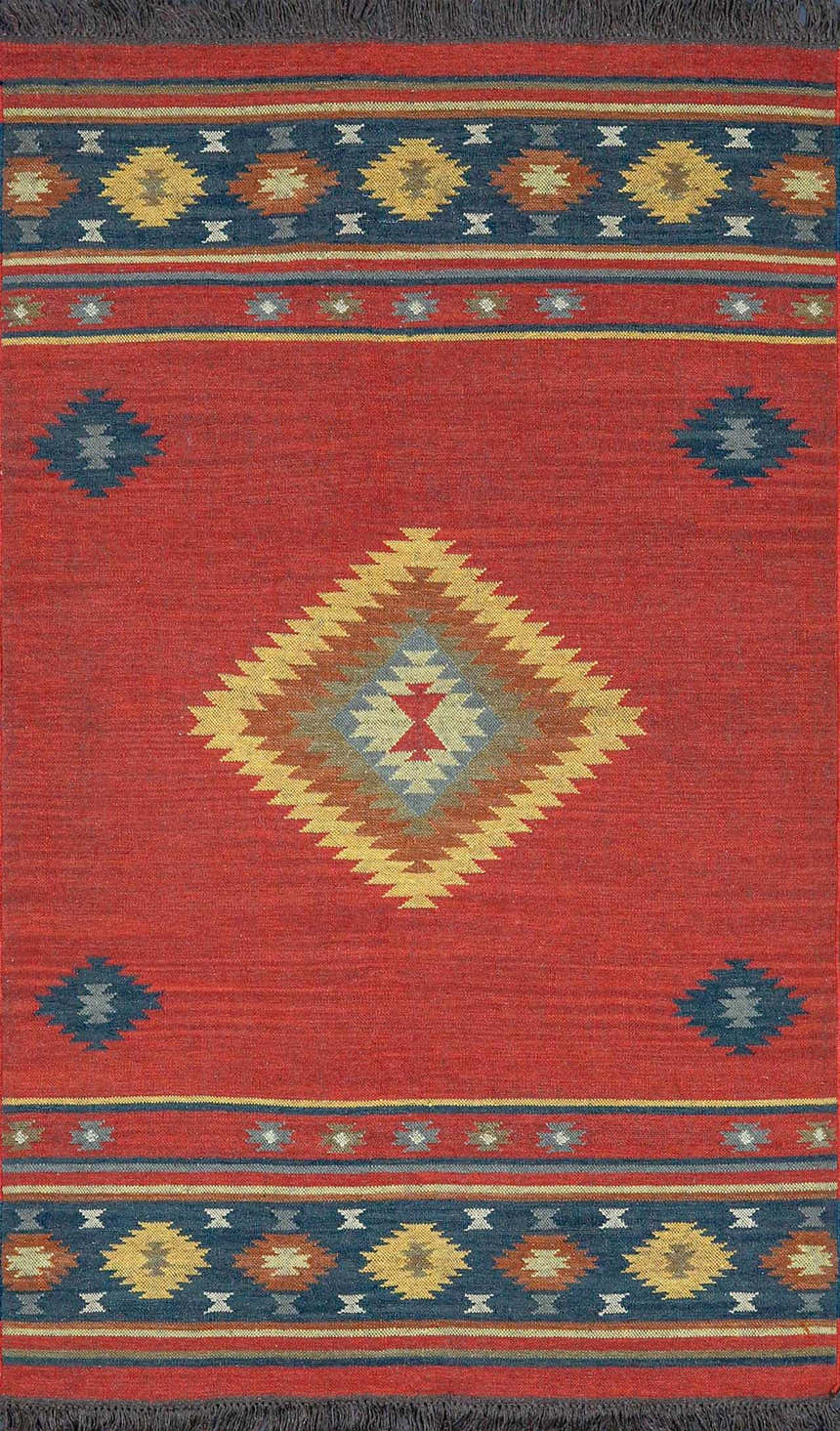 Close-up of the Hedon Wool Area Rug featuring a brick red base and Southwestern-inspired diamond and geometric patterns. Design-Rectangle