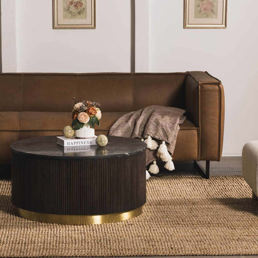Living room scene with brown leather sofa, round coffee table, and beige Oaks Perfect Flatweave Jute Rug. Roomscene-Rectangle