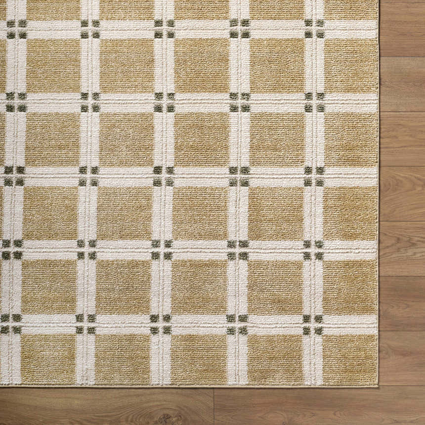 Close-up of Kalkin Tan Area Rug. Contemporary style, tan and cream plaid pattern with olive green accents. Corner