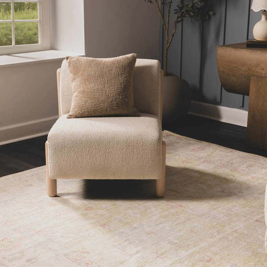Living room scene with a Bozkurt Boutique Washable Rug in cloud gray, styled under a modern chair and wood console table. Roomscene-Rectangle
