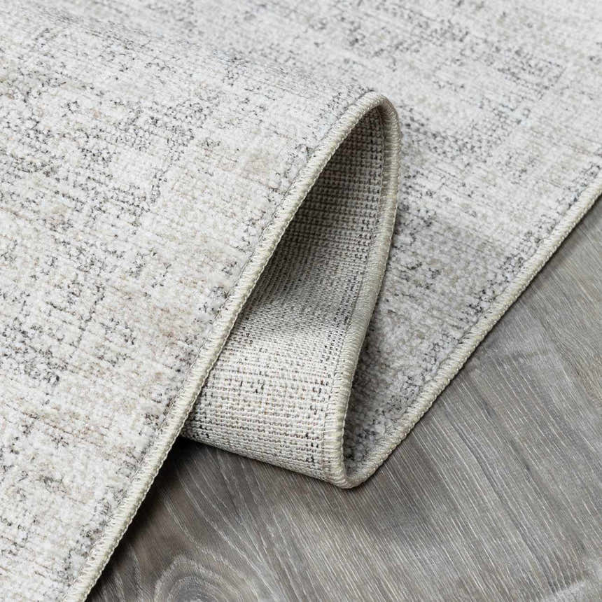 Close-up of Livabliss x Galey Alix Maria Elena V Vintage Medallion Area Rug showing ivory, tan, and brown colors. Fold