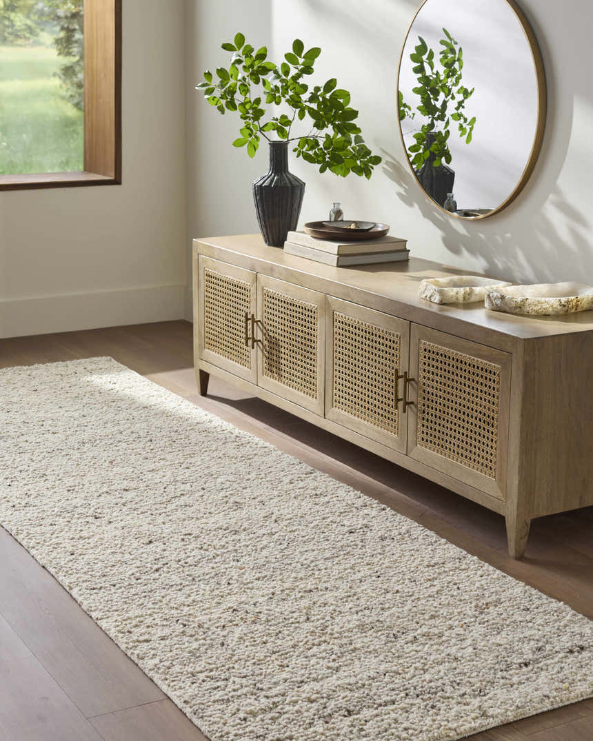 Entryway with Winta Beige Wool Runner Rug leading to a console table with a round mirror. Roomscene-Runner