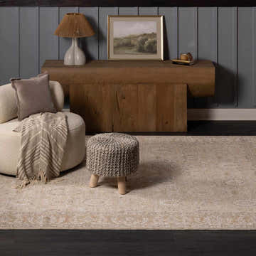 Living room scene with beige Airlia Cream Thick Luxe Area Rug, round chair, and wooden console table. Roomscene-Rectangle