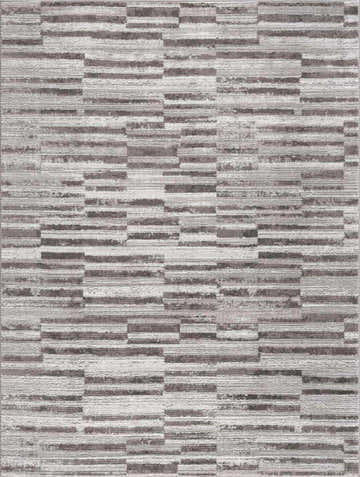 Close-up of the Arissa Broken-Striped Area Rug. Geometric design in black, gray, and white. Machine woven texture. Design-Rectangle-5373