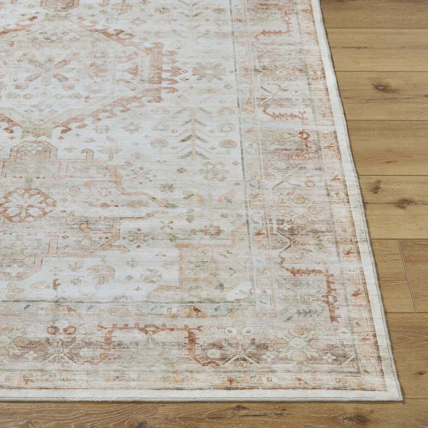 Close-up of Laran Rust Distressed Washable Area Rug showing traditional brick red and light gray pattern and soft texture. Front