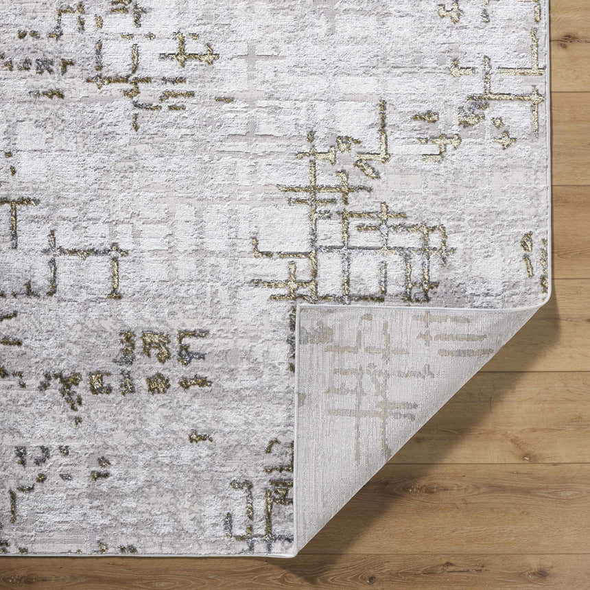 Close-up of the Auriel Gray Area Rug showing its contemporary charcoal, cream, and olive abstract design. Fold