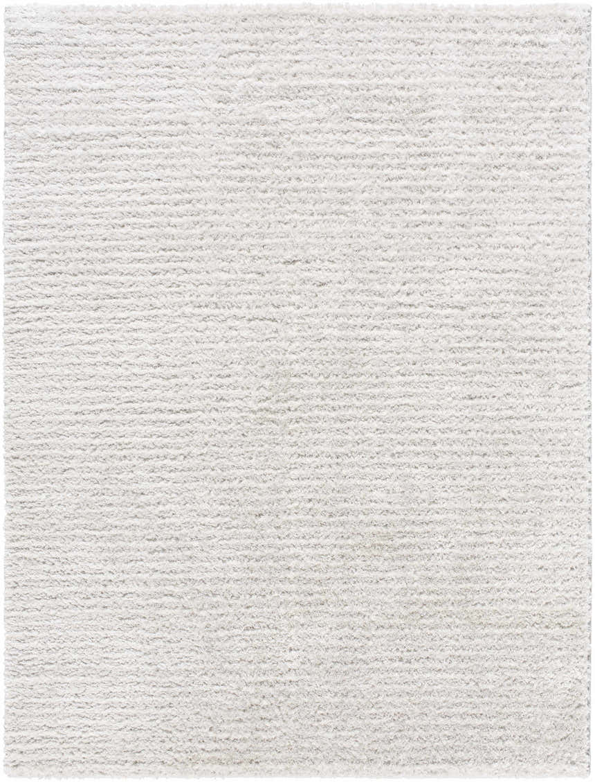 Close-up of the Alysha Area Rug. Soft, textured shag in shades of gray and white. Machine woven polyester. Design-Rectangle-537
