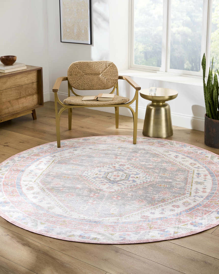 Light-filled living room with round Maha Washable Area Rug in bone, faded driftwood, mocha, and steel. Farmhouse style. Roomscene-Round