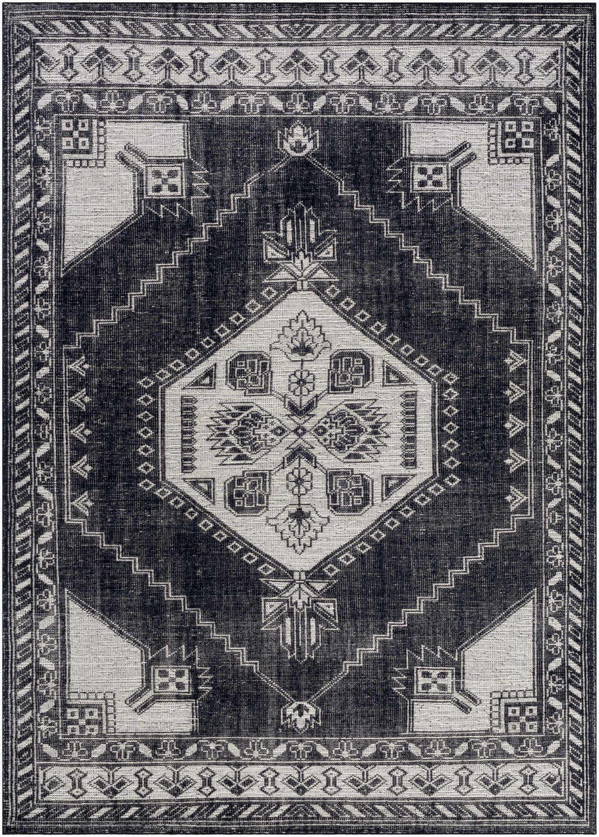 Close-up of the Minapan Premium Area Rug. Hand-knotted rug in black and cream with a traditional geometric pattern. Design-Rectangle-811