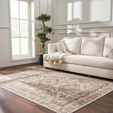 Living room scene with a Diem Area Rug in brick red, charcoal, dusty pink, light gray, mustard, off white, and sky blue. Roomscene-Rectangle