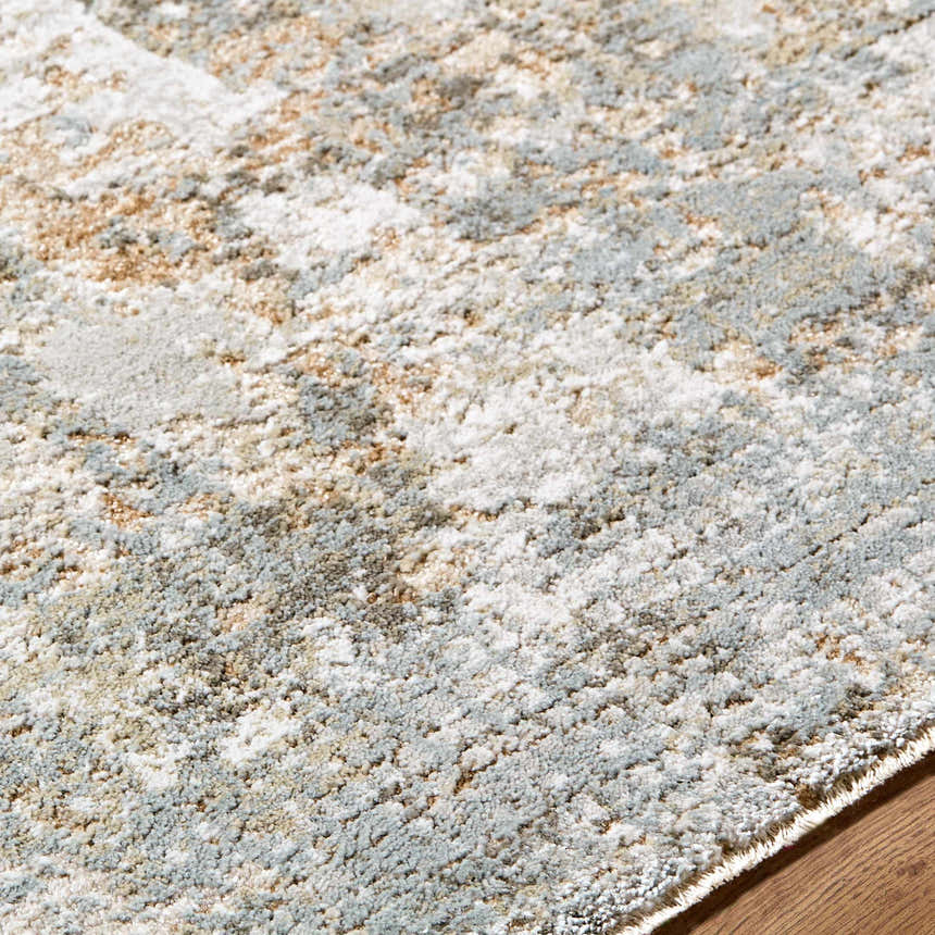 Close-up of the Marli Thick Luxe Area Rug showing its charcoal, cream, and light brown abstract pattern and plush texture. Texture