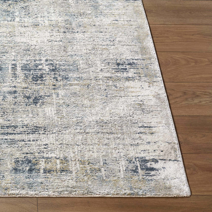 Close-up of the Neron Thick Luxe Abstract Rug showing its blue, charcoal, cream, and mustard colors and textured design. Front