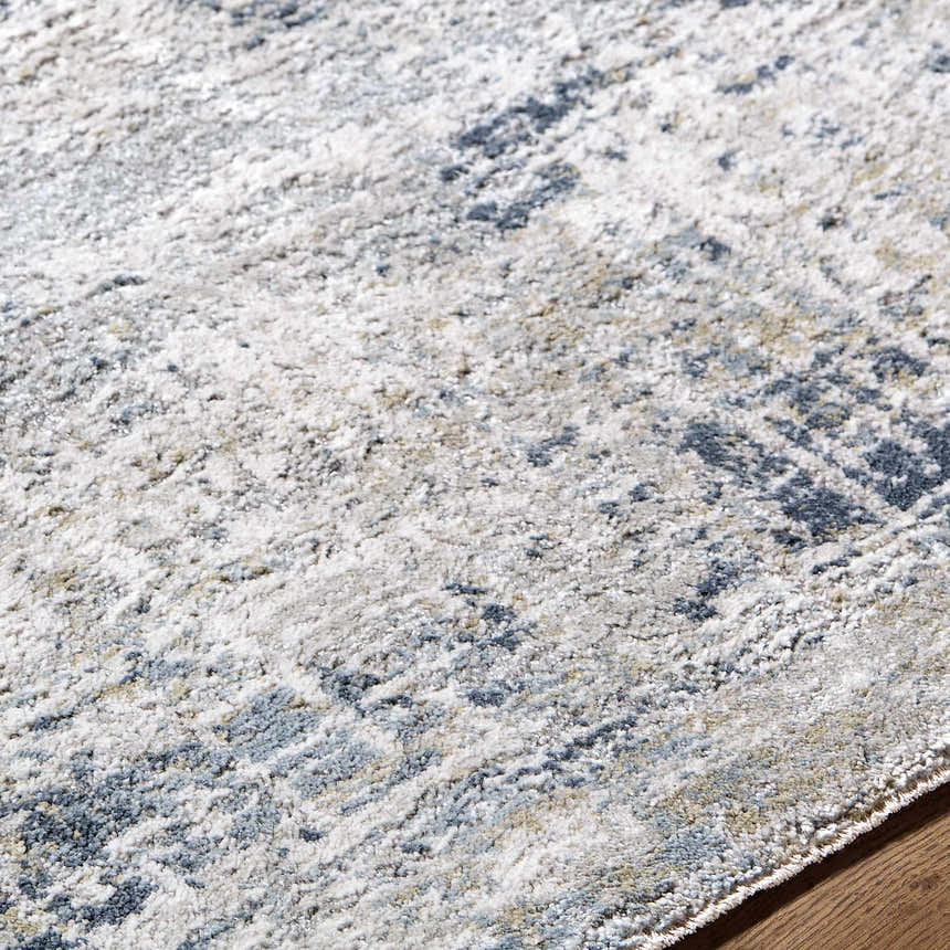 Close-up of the Neron Thick Luxe Abstract Rug, showing its blue, cream, and gray abstract pattern and thick, soft texture. Texture