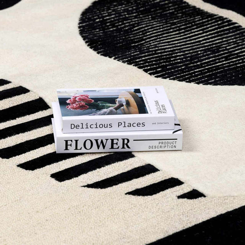 Close-up of the Brooklyn Modern hand-tufted wool area rug, showcasing its black and cream geometric design and soft texture. Styleshot