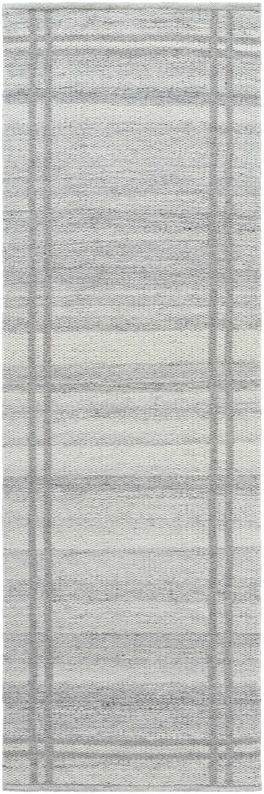 Close-up of the hand woven Nimue Gray Area Rug. Gray and ivory wool rug with a subtle striped pattern. Design-Runner-268