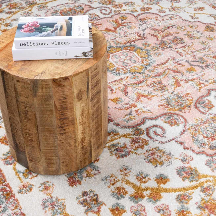 Close-up of the Oark Floral Medallion Area Rug, featuring brick red, camel, and dusty pink floral patterns. Styleshot